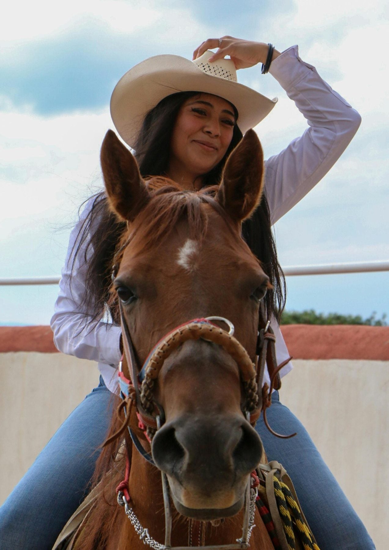 Smiling cowgirl in a hat